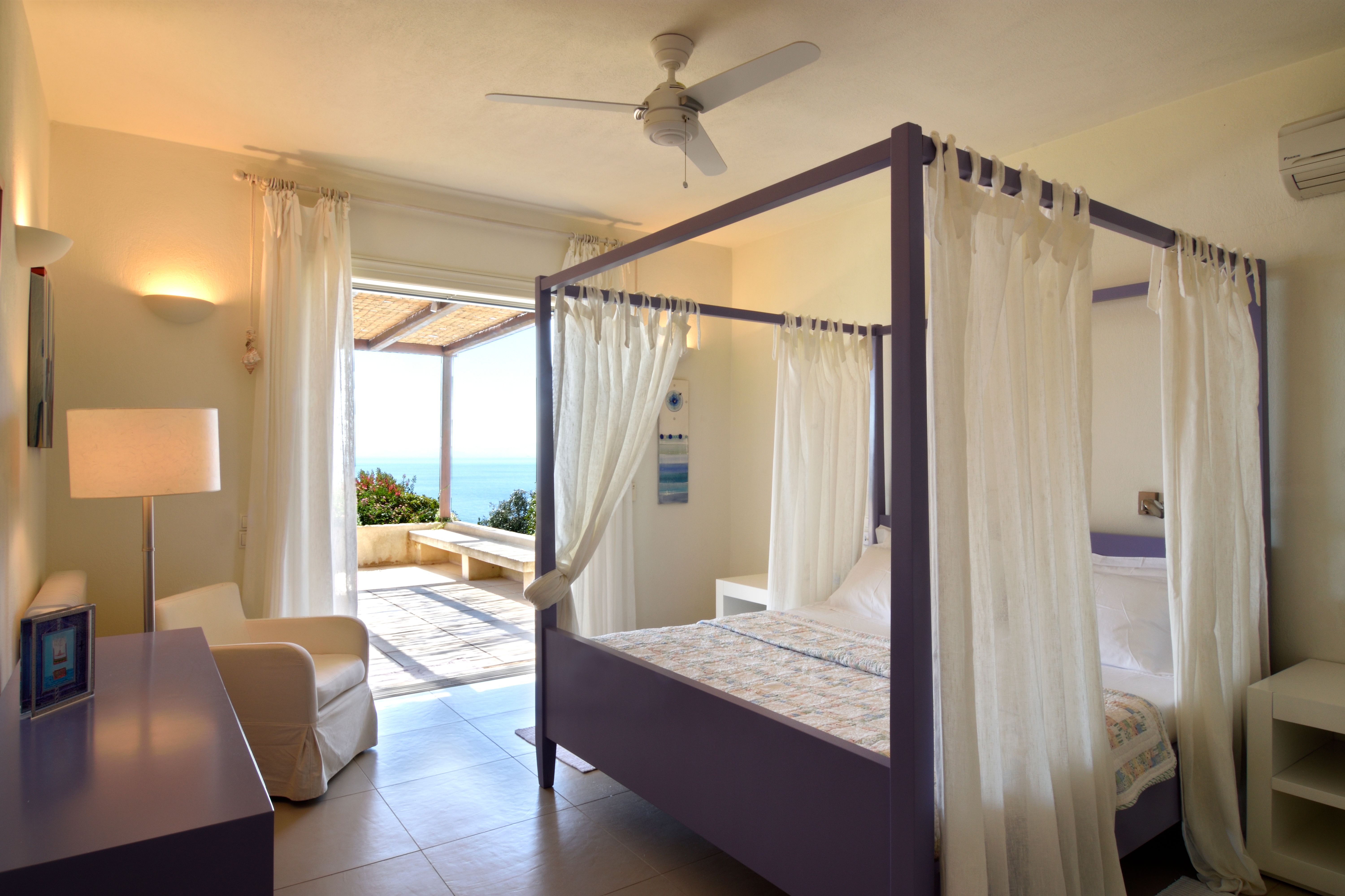 A first-floor suite with a curtained four-poster bed