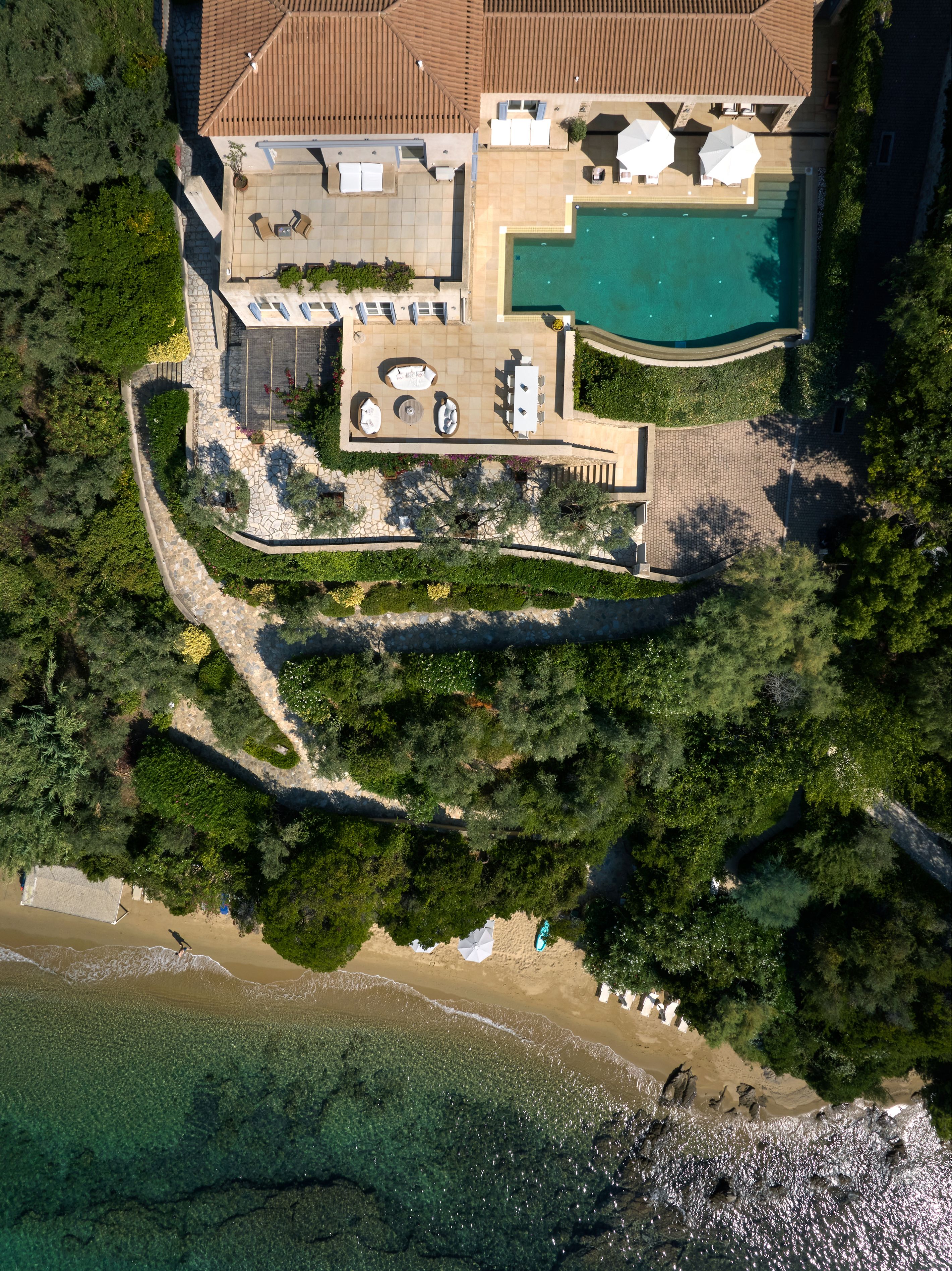 The terraces of Villa Goldie and the path down to the sand, from above