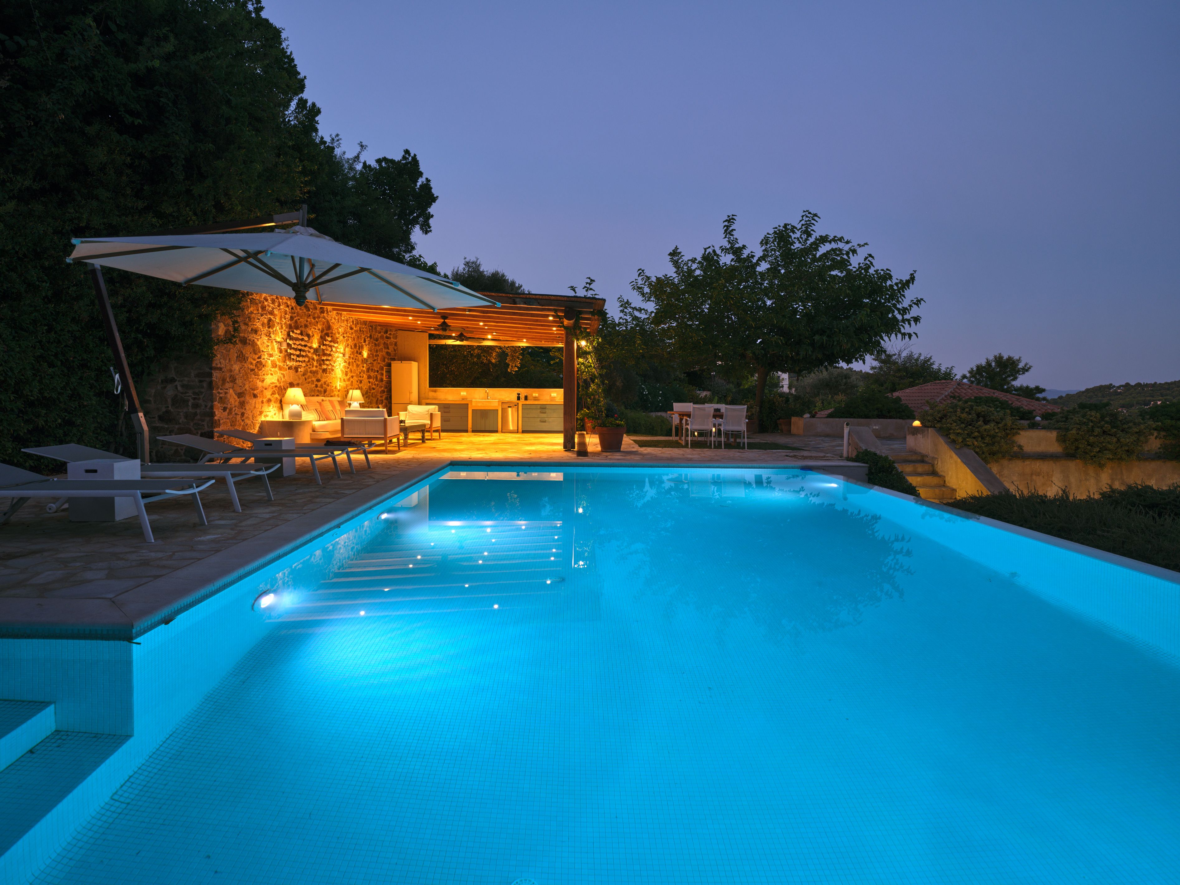 The pool lit up at dusk