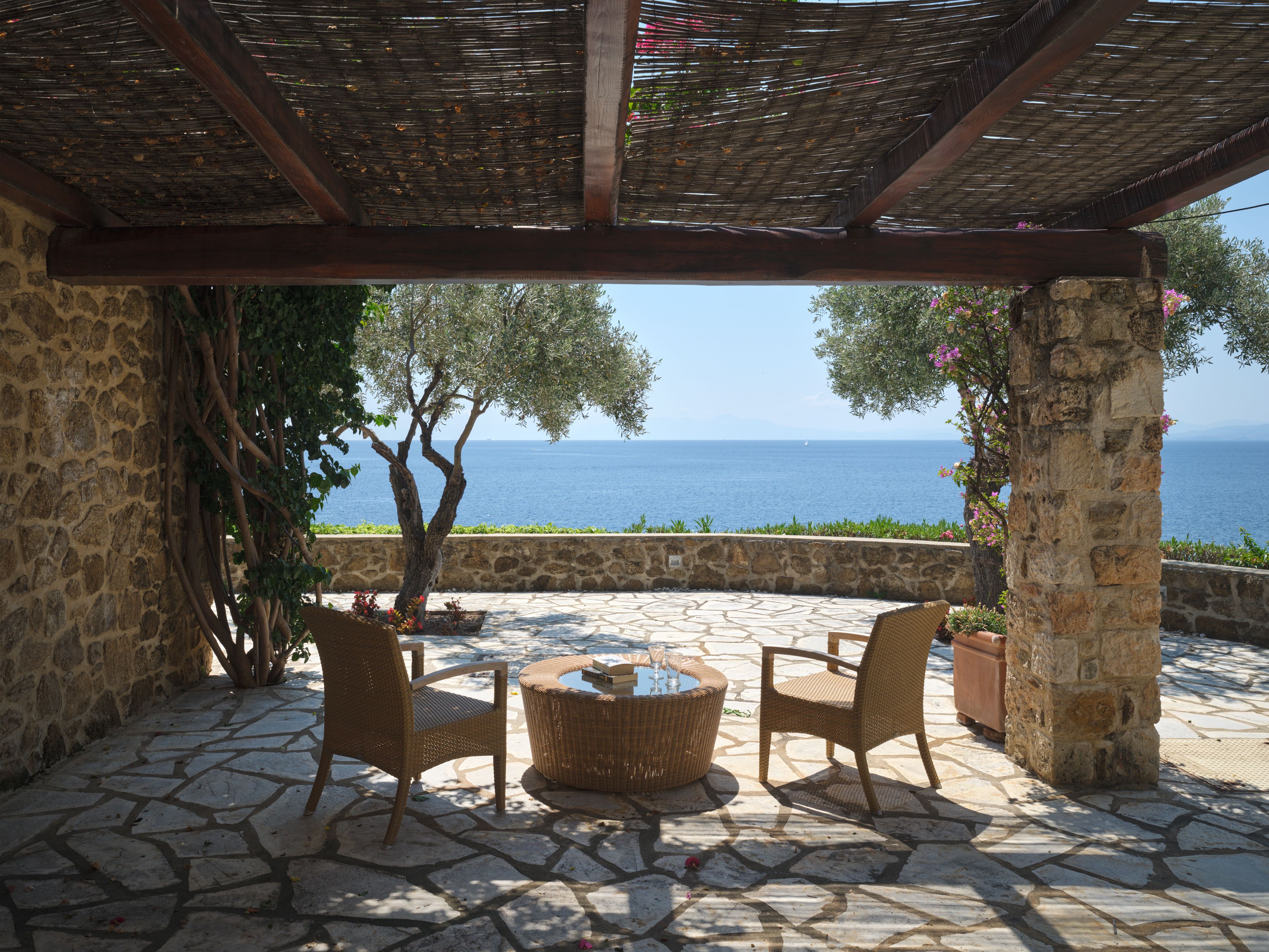 The shaded stone terrace outside the second master suite