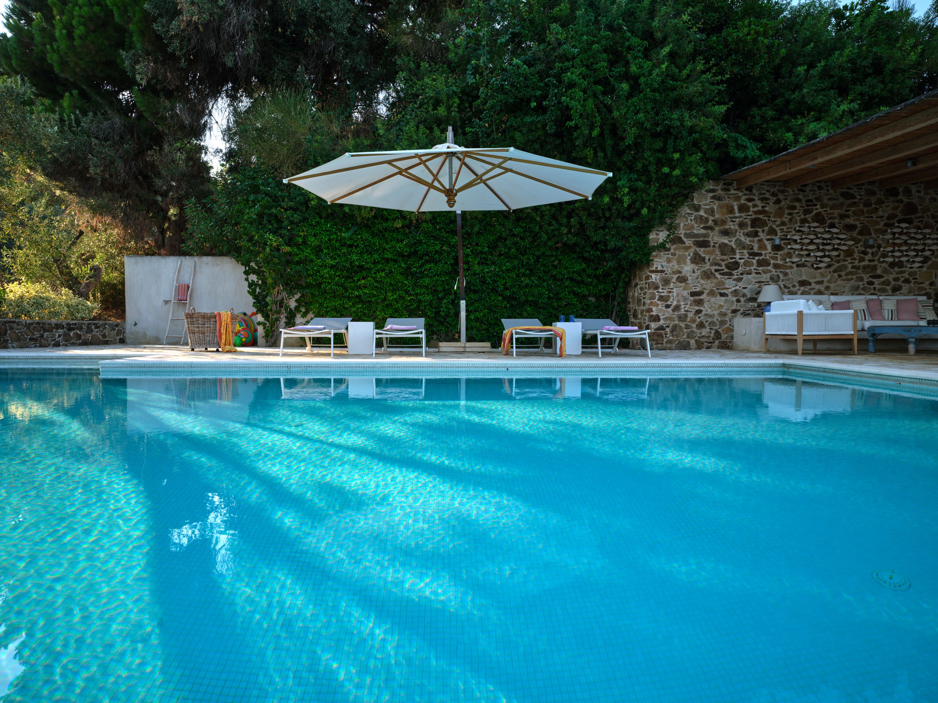 The pool and the stone-walled pool deck