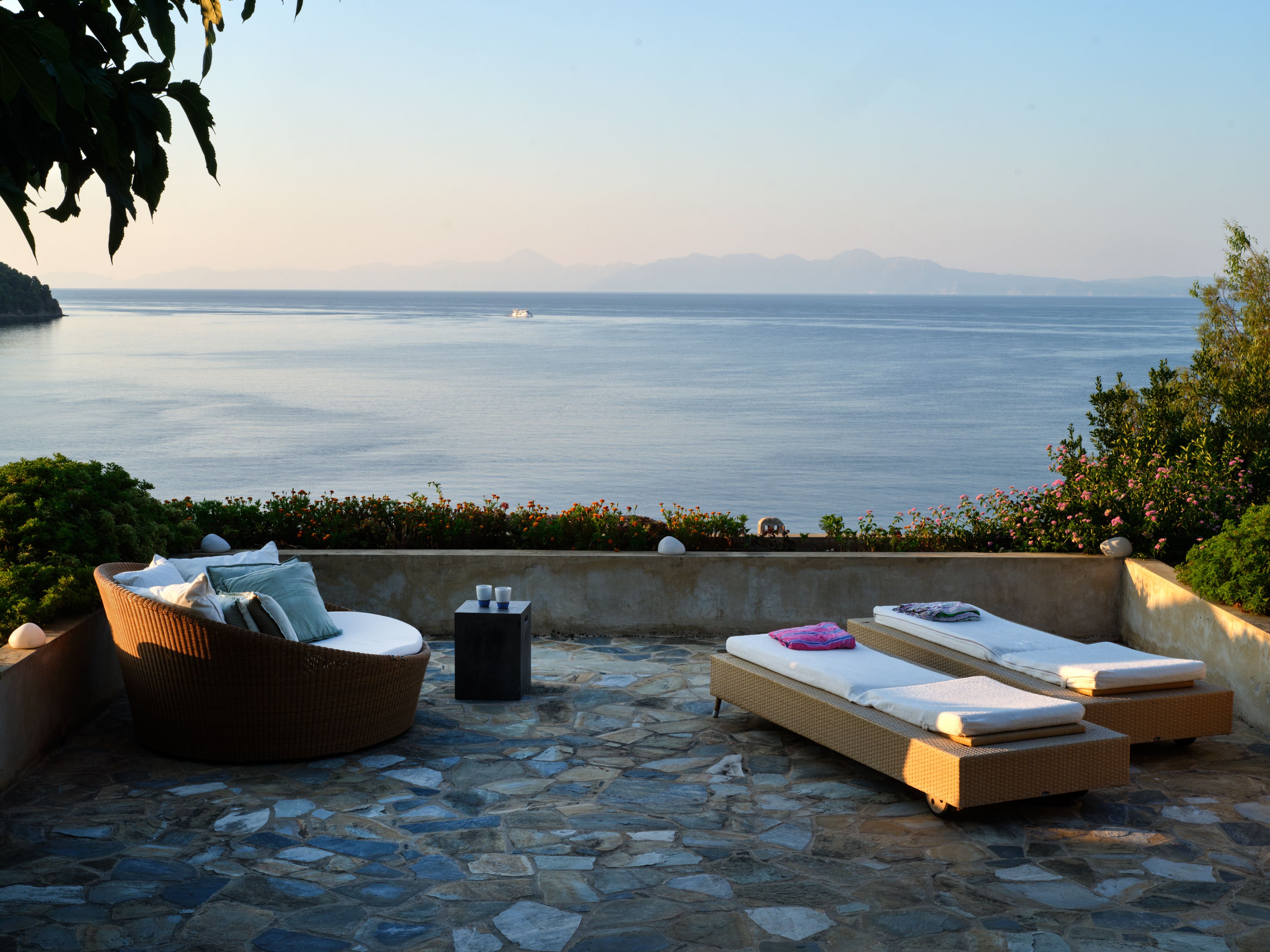 Daybeds on the sun terrace looking out to sea
