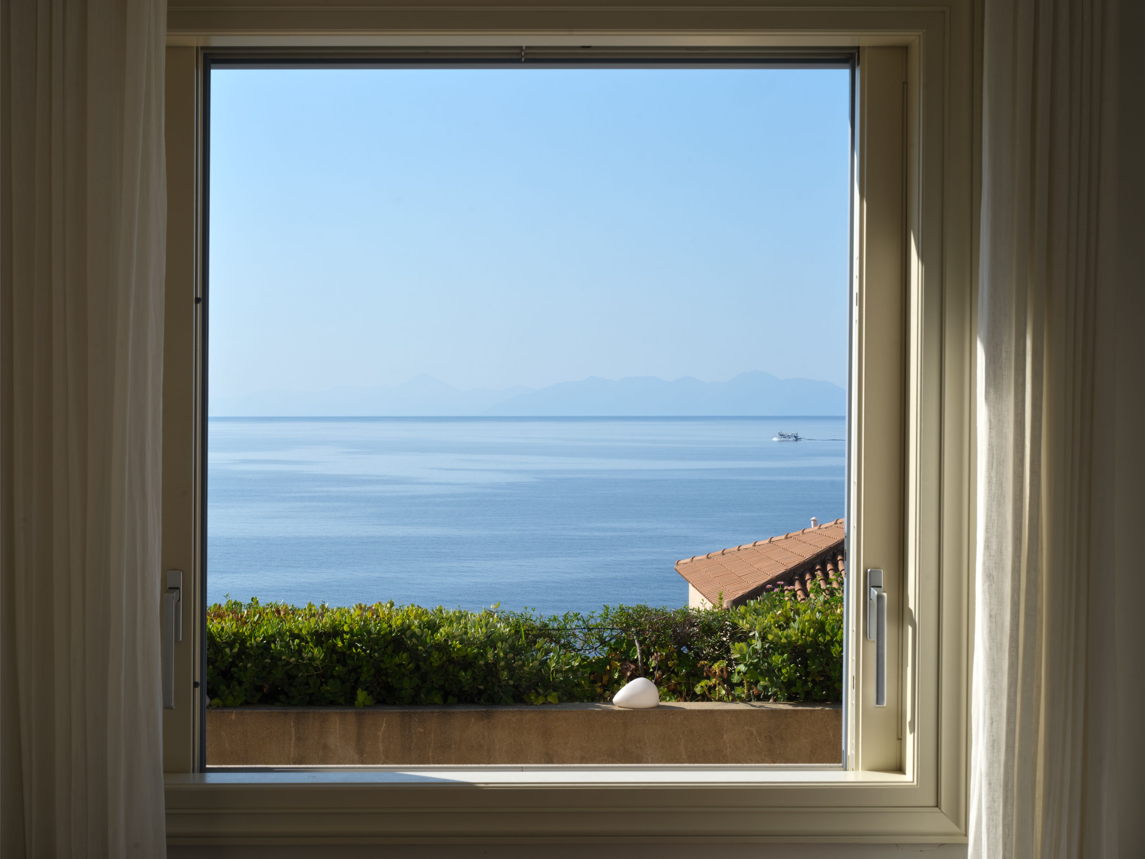 The sea framed by a living room window